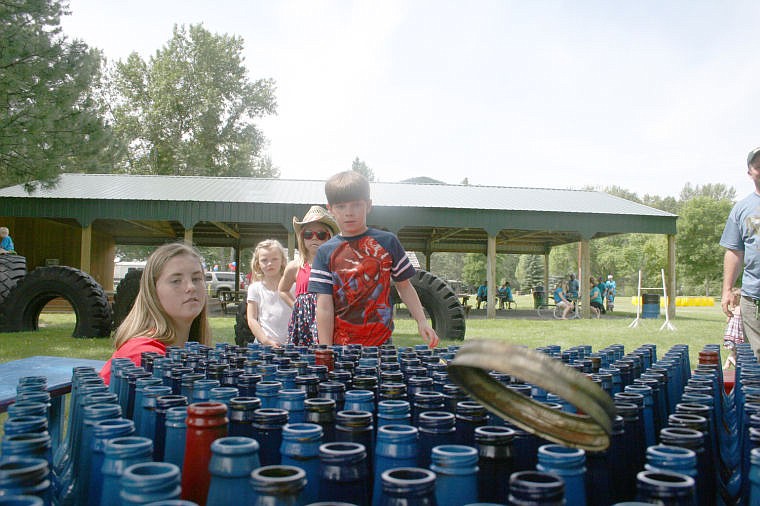 &lt;p&gt;McKenzie Stortz, left, oversees the ring toss during the children's games in St. Regis for the Fourth of July celebration.&lt;/p&gt;