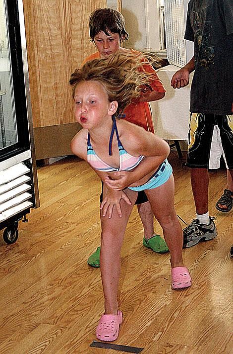 Jason Shueh/Valley Press Julia Gumenyuk, age 9, spits a cherry pit at the Hot Springs July 4 pit spit contest. Gumenyuk placed second.