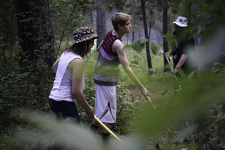 &lt;p&gt;Katie Ness, a sophomore at New Vision High School, rakes a path at Treaty Rock Park Thursday in Post Falls. The school&#146;s environmental math and science classes have been working in the park to create defined trails throughout the area.&lt;/p&gt;
