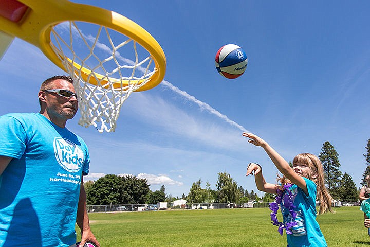 &lt;p&gt;Miley Robinson, 6, shoots a basketball at the Boys and Girls Club in Post Falls on Saturday during the clubs free family fun day.&lt;/p&gt;