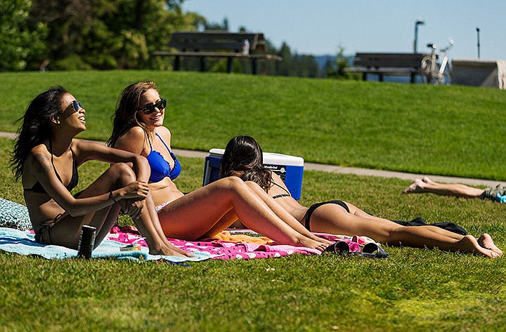 &lt;p&gt;Shai Walker, left, Mackenzie Banning and Brittnee Willoughby, far right, enjoy the afternoon sunbathing at Independence Point Friday in Coeur d&#146;Alene. Temperatures are expected to soar into the 90s over the weekend.&lt;/p&gt;