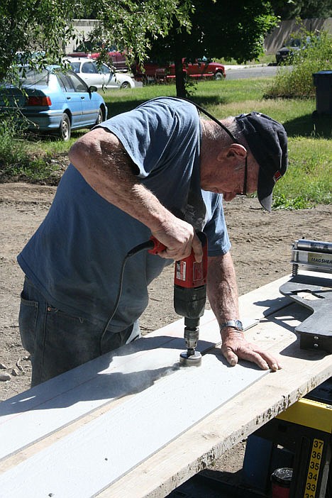 &lt;p&gt;Volunteer Bob Siebert of Post Falls wields a power drill at the Habitat for Humanity of North Idaho house on Saturday.&lt;/p&gt;