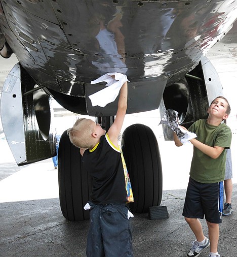 &lt;p&gt;Hayden Rosdahl (left), 7, and Isaac Pearce, 9, help wipe oil from the belly of a World War Two-era B-29 Superfortress bomber during its stop at Coeur d'Alene Airport for an air show. The vintage bird, &quot;Fifi,&quot; is the only flyable B-29 in operation.&lt;/p&gt;