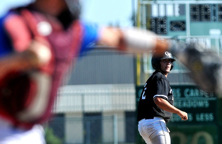 Twins' player Dustin VonFeldt is forced to return and stay on third base.