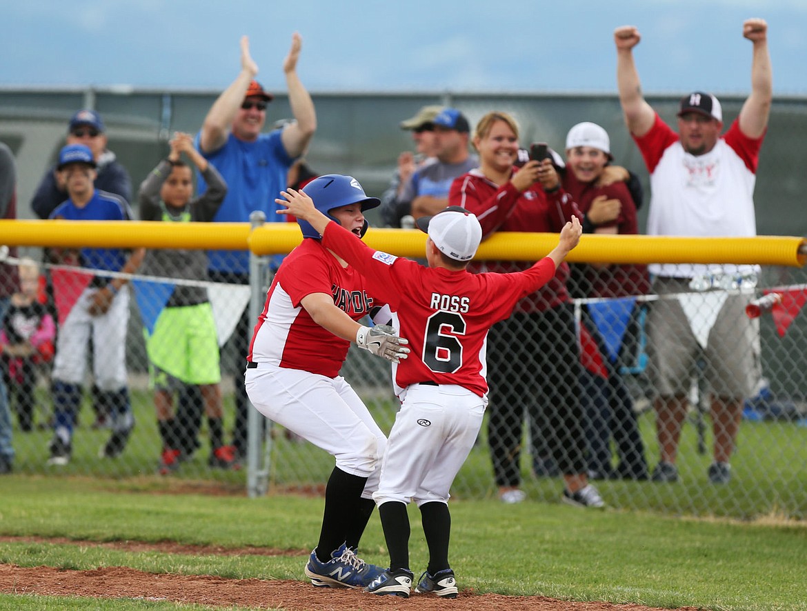 &lt;p&gt;LOREN BENOIT/Press Romann Schaefer, left, is greeted at first base by Brayden Ross after schaefer singled in the winning run against Coeur d'Alene during the Idaho District 1 Championship game on Saturday in Hayden. Hayden was down 5-1 but roared back in the late innings, winning 6-5.&lt;/p&gt;