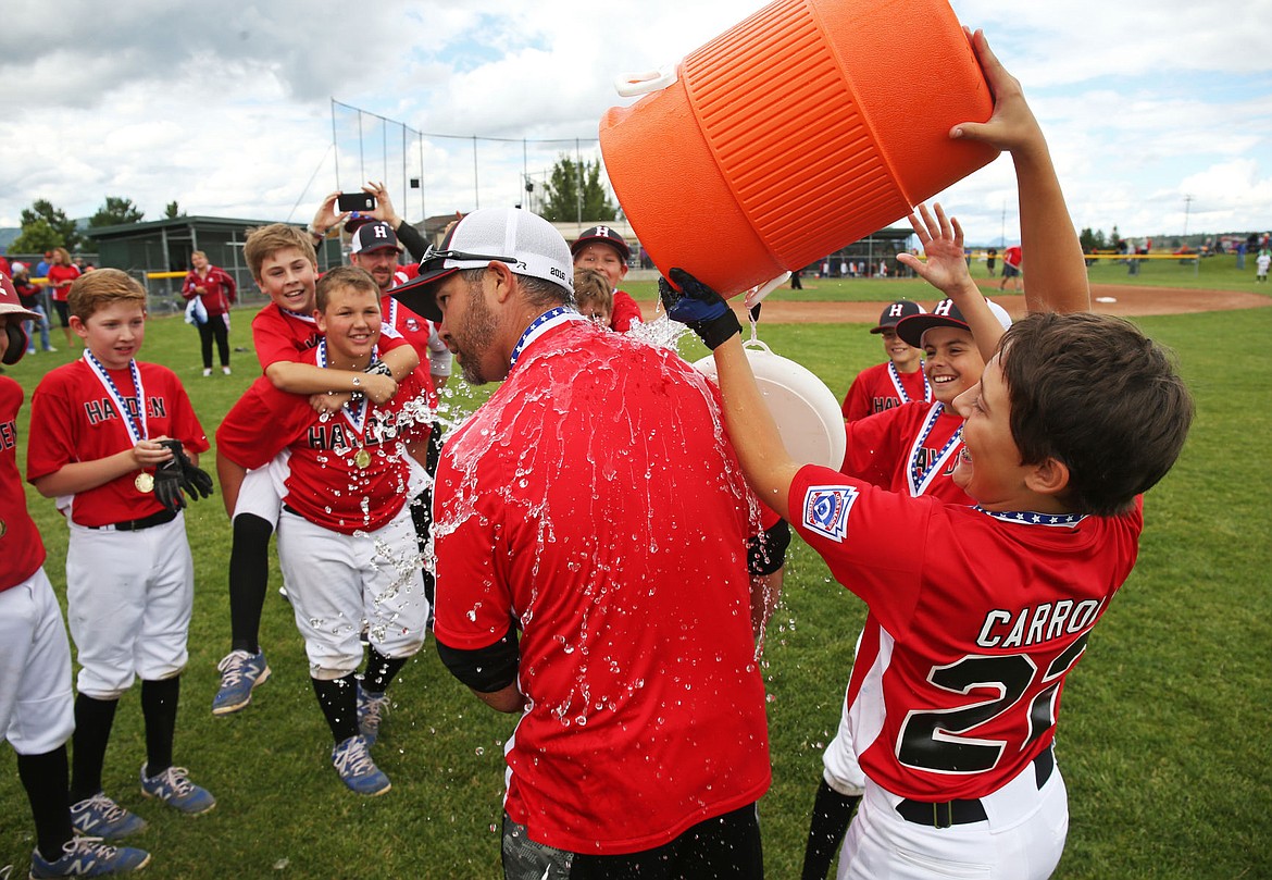 &lt;p&gt;LOREN BENOIT/Press Calvin Carroll, right, pours ice cold water over head coach Rob Ross's head after the team won their Idaho District 1 Championship game against Coeur d'Alene on Saturday.&lt;/p&gt;