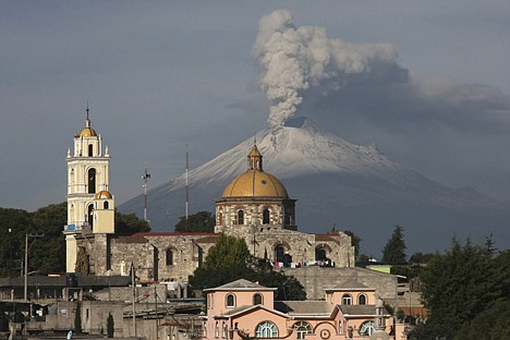 &lt;p&gt;The main church in the town of San Damian Texoloc, Mexico stands in front of the Popocatepetl volcano as is spews ash and vapor early Tuesday. Last Saturday, Mexico's National Center for Disaster Prevention raised the volcano alert from Stage 2 Yellow to Stage 3 Yellow, the final step before a Red alert, when possible evacuations could be ordered after the Popocatepetl volcano spit out a cloud of ash and vapor 2 miles high over several days of eruptions.&lt;/p&gt;