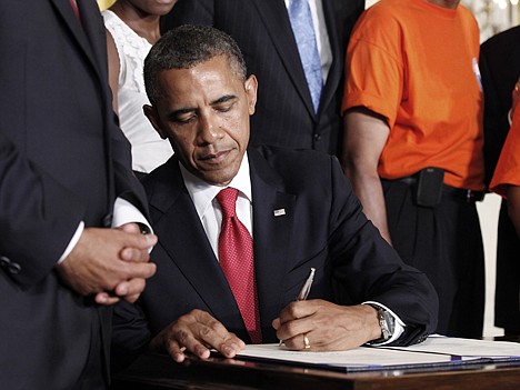 &lt;p&gt;FILE - In this July 6, 2012 file photo, President Barack Obama signs the Surface Transportation Bill, in the East Room of the White House in Washington. A new law reduces by billions of dollars what companies have to contribute to their pension funds, raising concerns about weakening the plans that millions of Americans count on for retirement. But with many companies already freezing or getting rid of pension plans, critics are reluctant to force the issue or even make much of a fuss. (AP Photo/Pablo Martinez Monsivais, File)&lt;/p&gt;