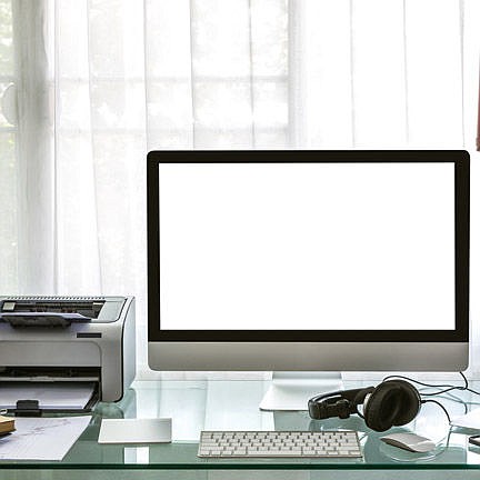 Modern home office with computer and laptop