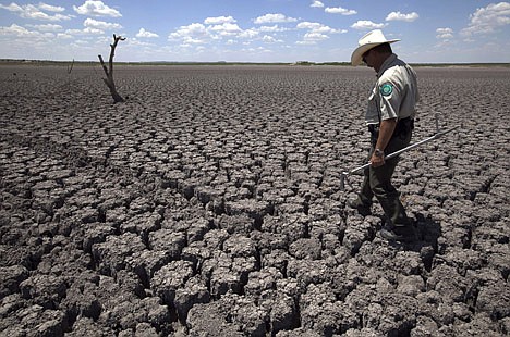 &lt;p&gt;FILE - In this Wednesday, Aug. 3, 2011 file photo, Texas State Park police officer Thomas Bigham walks across the cracked lake bed of O.C. Fisher Lake in San Angelo, Texas. A combination of the long periods of 100-plus degree days and the lack of rain in the drought-stricken region has dried up the lake that once spanned over 5400 acres. The year 2011 brought a record heat wave to Texas, massive floods in Bangkok and an unusually warm November in England. How much has global warming boosted the chances of events like that? Quite a lot in Texas and England, but apparently not at all in Bangkok, according to new analyses released Tuesday, July 10, 2012. Researchers calculated that global warming has made such a Texas heat wave about 20 times more likely to happen during a La Nina year. (AP Photo/Tony Gutierrez)&lt;/p&gt;