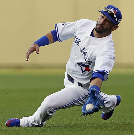 &lt;p&gt;American League's Jose Bautista, of the Toronto Blue Jays, catches a fly ball hit by National League's Ryan Braun, of the Milwaukee Brewers, during the second inning of the MLB All-Star baseball game, Tuesday, July 10, 2012, in Kansas City, Mo. (AP Photo/Charlie Riedel)&lt;/p&gt;