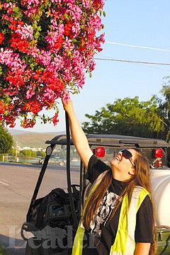 &lt;p&gt;Aneena Antiste tends to the blossoming flower pots that line Main Street in Polson.&lt;/p&gt;