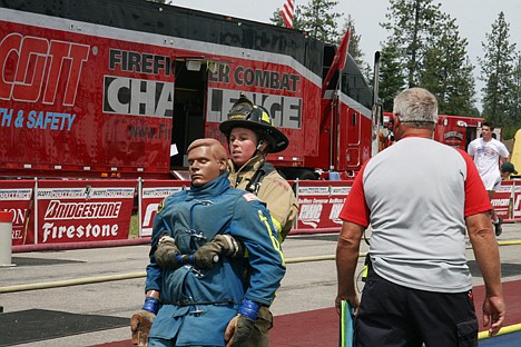 &lt;p&gt;Firefighter Mandy Jacques of the Coeur d'Alene Fire Department drags a 175-pound dummy at the Scott Firefighter Combat Challenge on Sunday. Hosted by Silverwood Theme Park, the event featured a multifaceted course that tested firefighters' skills. About 100 firefighters from across the Northwest and Canada attended.&lt;/p&gt;