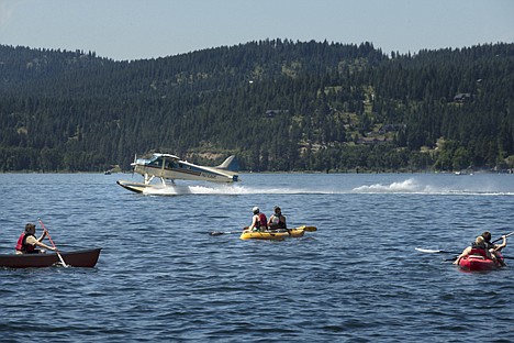 &lt;p&gt;Kayakers with Camp Ka-Mee-Lin, a summer camp for children ages 10 to 12, watch as a pontoon plane takes off from Lake Coeur d'Alene Tuesday afternoon.&lt;/p&gt;