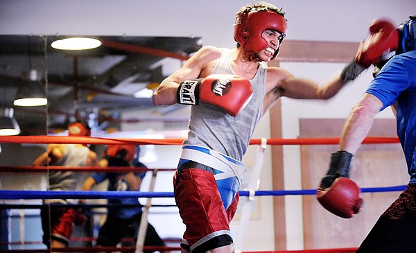 Duran Caferro of Helena, Mont. sparing with Flathead Boxing Coach Phil Moore on Saturday at Straight Blast Gym in Kalispell. Caferro is a U.S. Olympic Athlete and winner of the 2009 USA Boxing National Championship.