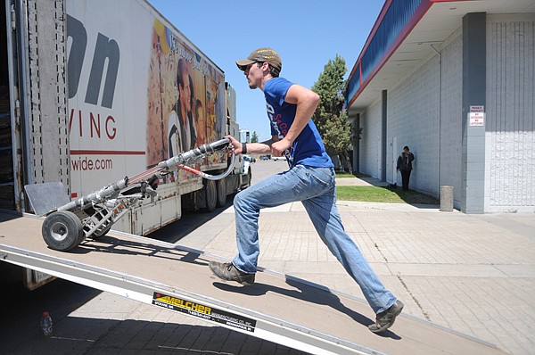 &lt;p&gt;Aaron Adams of Blair Transfer of Missoula heads back into a
truck loaded with donations for Second Helpings, the new second
hand store run by the Flathead Food Bank on Tuesday in
Kalispell.&lt;/p&gt;