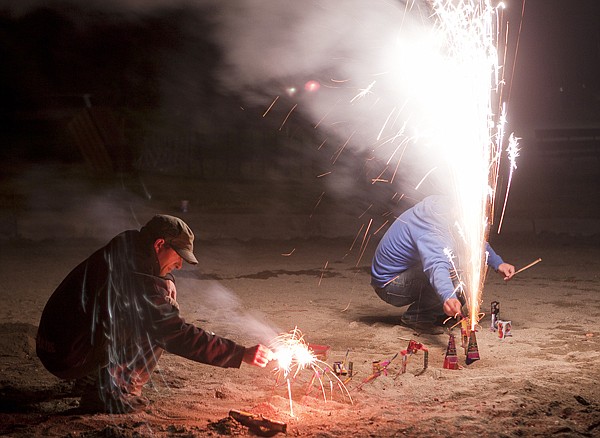 &lt;p&gt;Bradley Hallett (left) and his brother Brennan light off
fireworks at Whitefish City Beach Saturday night.&lt;/p&gt;