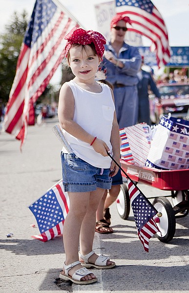 &lt;p&gt;Jaboa Treutel, 4, takes a break from giving away candy during
Kalispell's Fourth of July parade on Monday morning. Other parades
in Bigfork and Polebridge honored the nation's birthday.&lt;/p&gt;