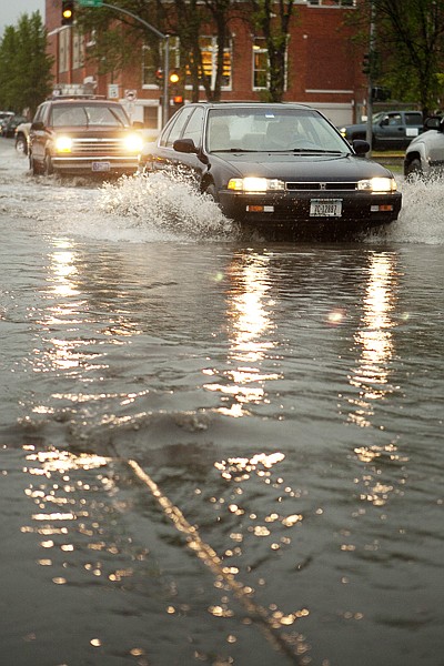 &lt;p&gt;Vehicles drive through a large puddle of water that formed at
the intersection of Spokane Avenue and Second Street in Whitefish
on Thursday night after heavy thunderstorms swept through the
Flathead Valley. Emergency responders fielded numerous reports of
lightning strikes, fallen trees and downed powerlines across the
county.&lt;/p&gt;