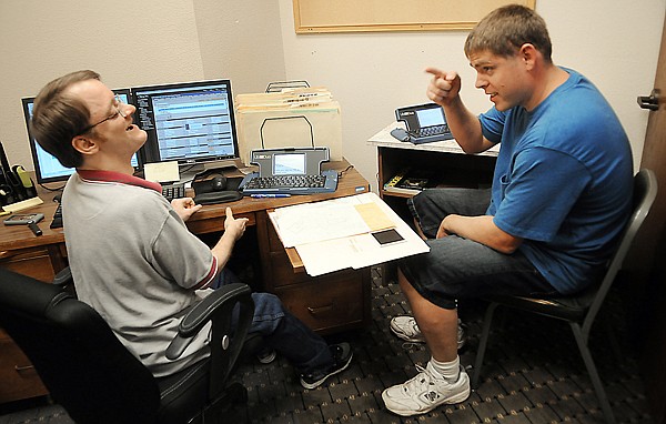 &lt;p&gt;Wheeler shares a laugh with co-worker Jason Stevens, a
commercial appraiser. Stevens has learned a bit of sign language
from Wheeler.&lt;/p&gt;