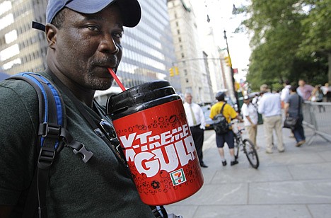 &lt;p&gt;Protester Eric Moore sips on an extra-large beverage during a protest against Mayor Michael Bloomberg's proposal to prohibit licensed food establishments from using containers larger than 16 ounces to serve high-calorie drinks at City Hall in New York, Monday, July 9, 2012. (AP Photo/Kathy Willens)&lt;/p&gt;