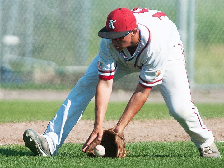 <p>Patrick Cote/Daily Inter Lake Kalispell Lakers third baseman Sean O'Connell fields a bunt Tuesday evening during the Lakers' matchup against Missoula at Griffin Field. Tuesday, July 10, 2012 in Kalispell, Montana.</p>