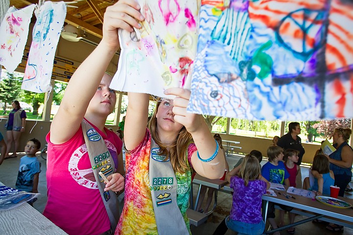 &lt;p&gt;SHAWN GUST/Press 12-year-olds Aspen Thomas and Samantha Dansereau, left, girl scouts with troop 2278, hang chromatographs to dry Thursday during a Hands n Science event at Rathdrum City Park. More than 80 area children participated in the event used primarily as a recruitment tool for the scout program. The art made through the chromatography process uses pigments separated through the application of a solvent.&lt;/p&gt;