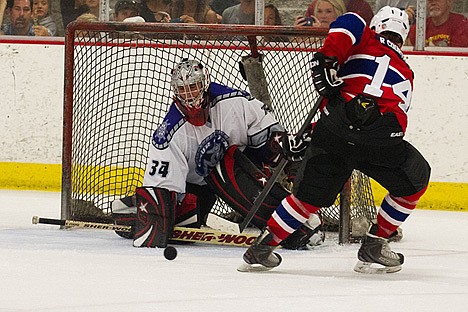 &lt;p&gt;Jason Greenwell, goal keeper for the Coeur d&#146;Alene Lakers, puts Gozzer NHL Legends&#146; Russ Courtnall&#146;s shot to a halt during the second period.&lt;/p&gt;
