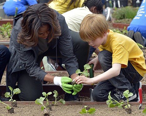 &lt;p&gt;First lady Michelle Obama and Bancroft Elementary School student Silas Stutz plant broccoli in the White House Kitchen Garden in Washington D.C., April 2.&lt;/p&gt;