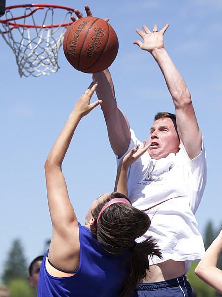 <p>Matt Jensen of the Lakers from Bigfork blocks Hailey Ruggels of the Princess and the Frogs from Kalispell in the co-ed division of the second annual 3-on-3 Battle of the Bay Jamboree in Bigfork on Saturday, July 7.</p>