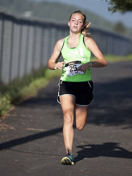 <p>Nicole Brist, 17, from Whitefish finishes first for the women in the Literacy Volunteers of Flathead County 5K fun run and walk in Kalispell on Saturday morning, July 7.</p>