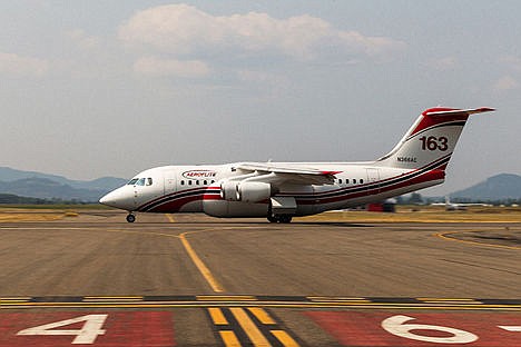 &lt;p&gt;An air tanker zooms down a runway at the Coeur d&#146;Alene Airport shortly before takeoff on its way to drop retardant on the fire in Bayview.&lt;/p&gt;