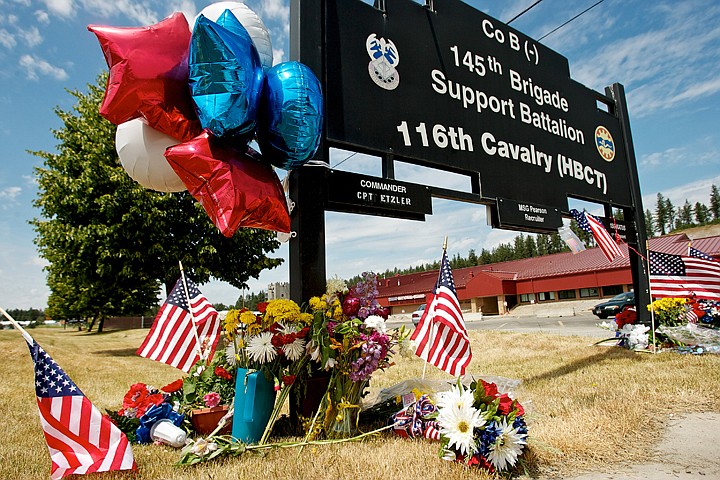 &lt;p&gt;JEROME A. POLLOS/Press Flags, balloons and flowers decorate the Idaho National Guard's unit sign Tuesday in Post Falls for Spc. Nathan R. Beyers, 24, and Spc. Nicholas W. Newby, 20, both of Coeur d'Alene, were killed by an improvised explosive device (IED) during an attack by insurgent Thursday in Baghdad.&lt;/p&gt;