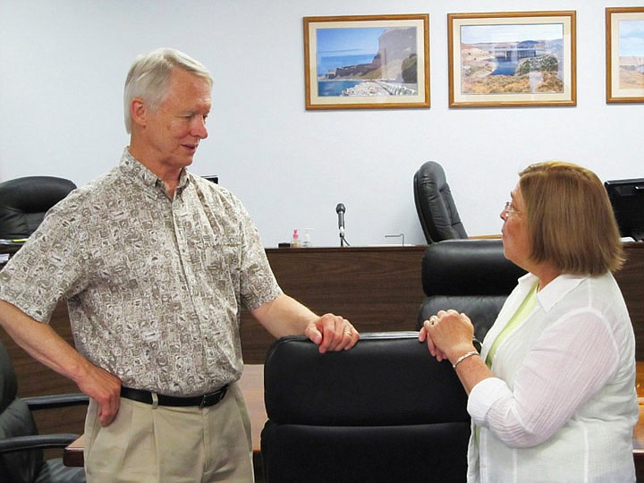 Washington State Secretary of State Sam Reed speaks to Grant County Commissioner Carolann Swartz during a tour of the courthouse. Reed toured the courthouse and the Nat Washington House on Wednesday.