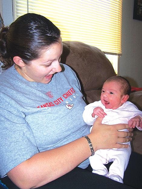 Karen Peterson/Leader&lt;br&gt;Anne Morigeau gave birth to a healthy baby girl, Emily Marie, on her living room floor last week, with the help of her mom, Katherine Mitchell, an EMT.