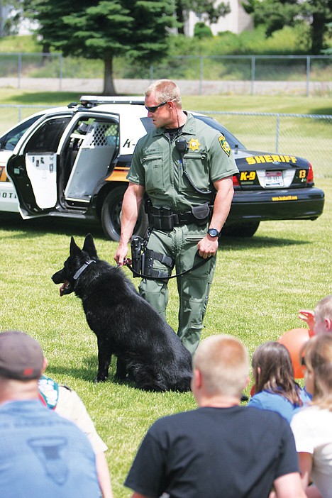 <p>Kootenai County Sheriff's Deputy Rich Lyons and K-9 companion, Brutus, interact with visitors at Be Prepared Day in Hayden.</p>