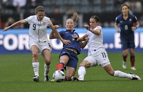 &lt;p&gt;France's Gaetane Thiney, center, is challenged by United States' Heather O Reilly and United States' Alex Krieger, right, during the semifinal match between France and the United States at the Women?s Soccer World Cup in Moenchengladbach, Germany, Wednesday, July 13, 2011. (AP Photo/Martin Meissner)&lt;/p&gt;