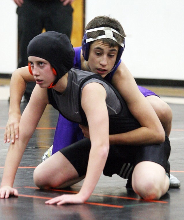 Rio Crismore, left, has been wrestling the boys for 11 years and this next fall she will wrestle in college at Jamestown on the female wrestling team.