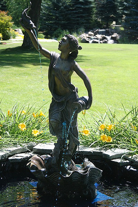 &lt;p&gt;This lady fountain in the Rolphe garden in Hayden spouts blue water Sunday during the 17th annual Garden Tour.&lt;/p&gt;