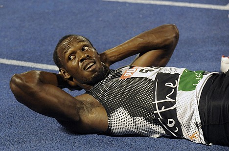 &lt;p&gt;COLLIN REID/Associated Press World-record holder Usain Bolt looks at the crowd while getting his right hamstring stretched out after loosing to fellow country man Yohan Blake in the 200-meter final at Jamaica's Olympic trials in Kingston, Jamaica, on July 1.&lt;/p&gt;