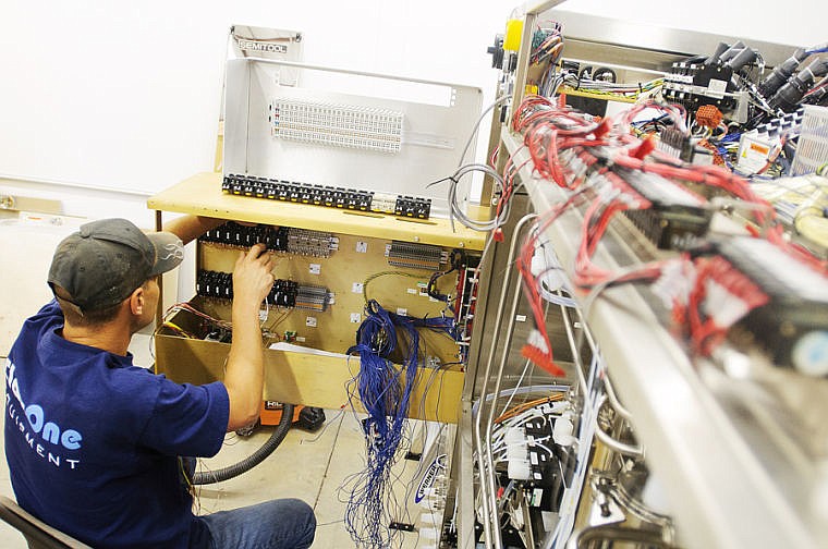 &lt;p&gt;Research and development technician Alan Murry installs a new control board into a Semitool spray solvent tool Friday afternoon at ClassOne Equipment in Kalispell. (Patrick Cote/Daily Inter Lake)&lt;/p&gt;