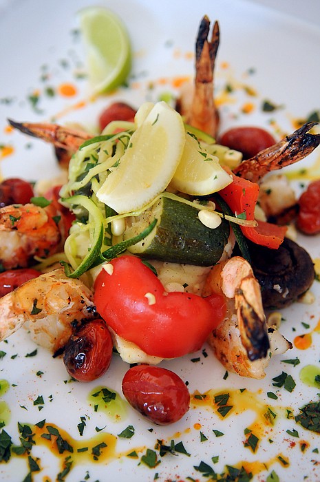 <p>One of the signature dishes at the Stillwater Fish House and Oyster Bar is the Roasted Garlic Shrimp which combines grilled Gulf shrimp with garlic mashers and blistered sweet grape tomatoes, finished with parsley.</p>
