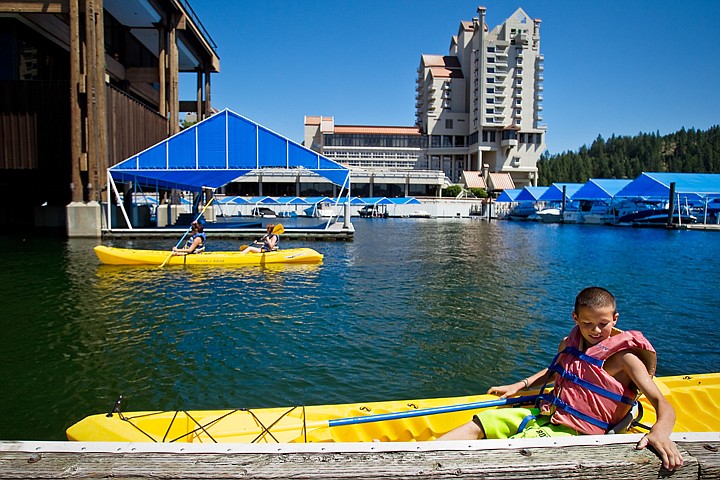 &lt;p&gt;The Coeur d'Alene Resort provides the backdrop as James Wilson, of Boise, 12, docks a rental kayak on the boardwalk Wednesday near the marina.&lt;/p&gt;