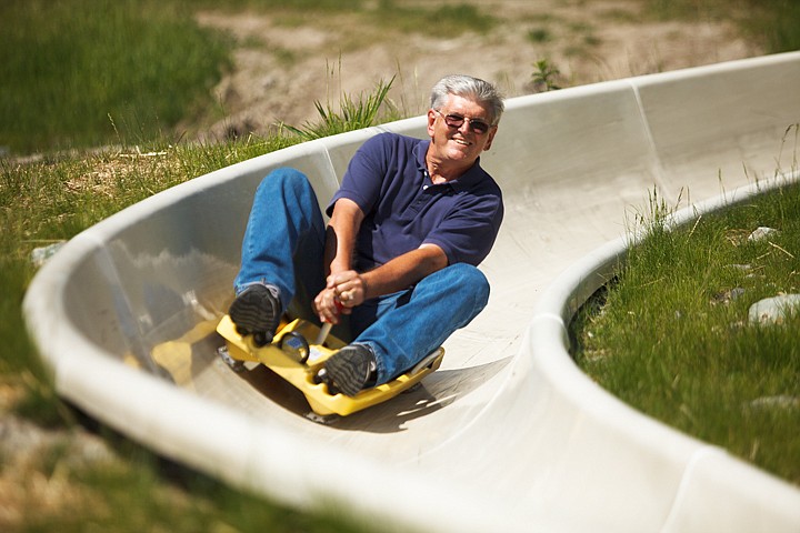 <p>Jim Cunningham of Texas takes a ride down the Alpine Slide Wednesday afternoon at Whitefish Mountain Resort. Wednesday, July 11, 2012 in Whitefish, Montana.</p>