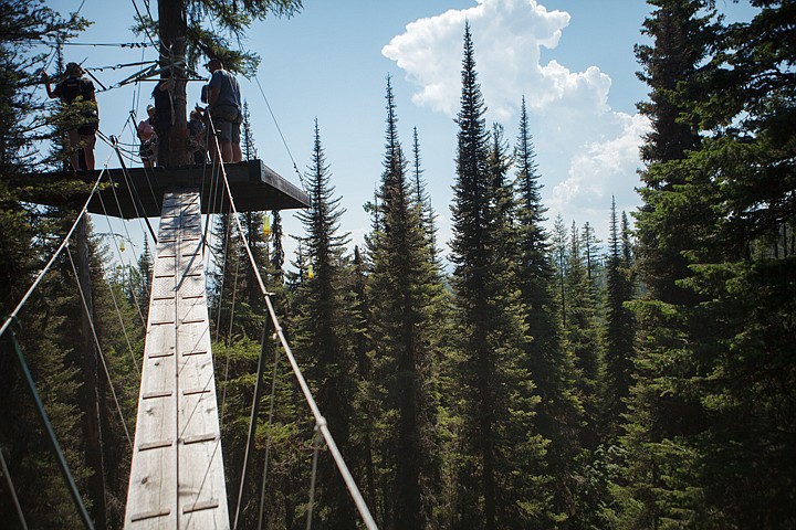 <p>Visitors of the Walk in the Treetops tour take a moment to enjoy the view from a platform 70 feet above the ground Wednesday at Whitefish Mountain Resort. Wednesday, July 11, 2012 in Whitefish, Montana.</p>
