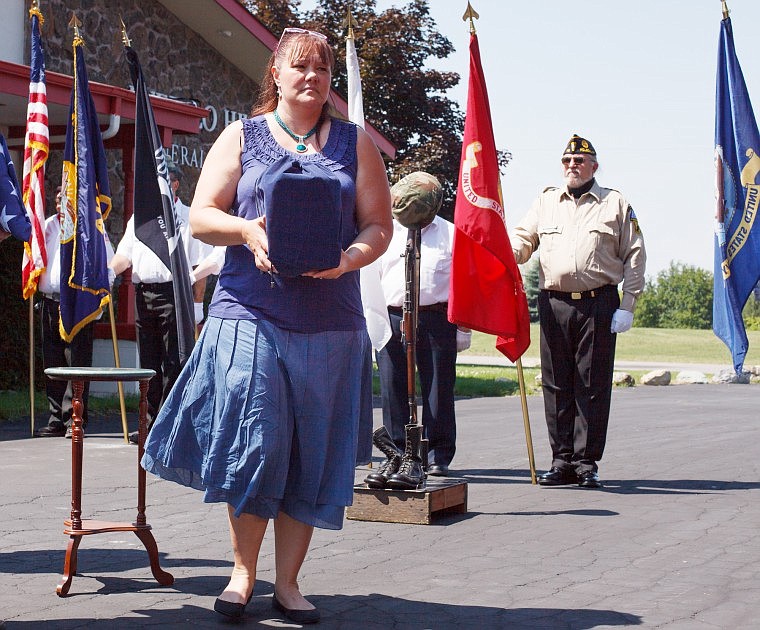 &lt;p&gt;Missing in America Project Montana Chaplain Rikki Perkins holds the cremains of Navy veteran Charles J. Shelton during a transfer ceremony at Buffalo Hill Funeral Home on Thursday afternoon. The cremains of five local military veterans will be transported by an honor guard today to Fort Harrison to their final resting place in the Montana State Veterans Cemetery.&lt;/p&gt;