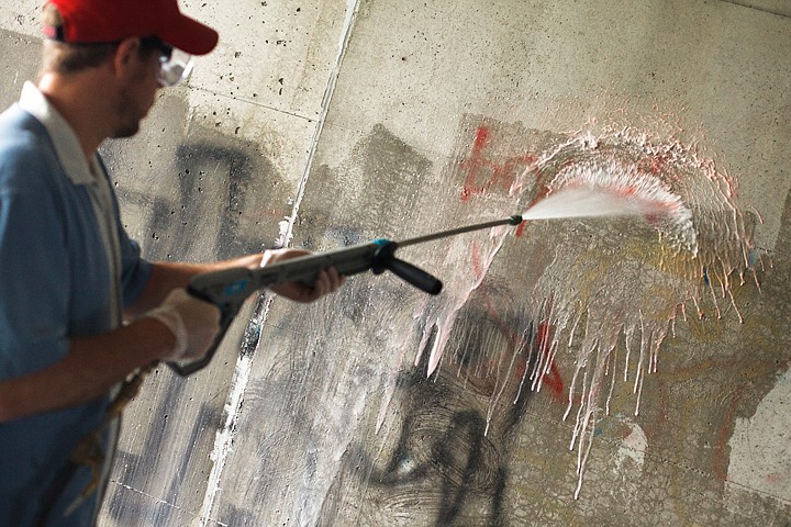 &lt;p&gt;Patrick Cote/Daily Inter Lake Kalispell City Manager Doug Russell uses a pressure washer to clean graffiti off the walls of the tunnel under U.S. 93 near Flathead Valley Community College Saturday morning during a community graffiti cleanup day. Saturday, July 14, 2012 in Kalispell, Montana.&lt;/p&gt;