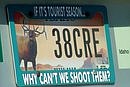 License plate frame aims at tourists