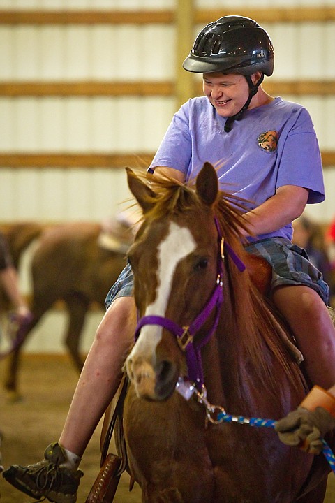 <p>Keenan Evans, 17, rides Penny, a 27-year-old Morgan, during a riding lesson at the Harmony Ranch Therapeutic Riding Center in Rathdrum. The non-profit offers therapeutic and educational sessions for developmentally disabled, elderly and at-risk children.</p>