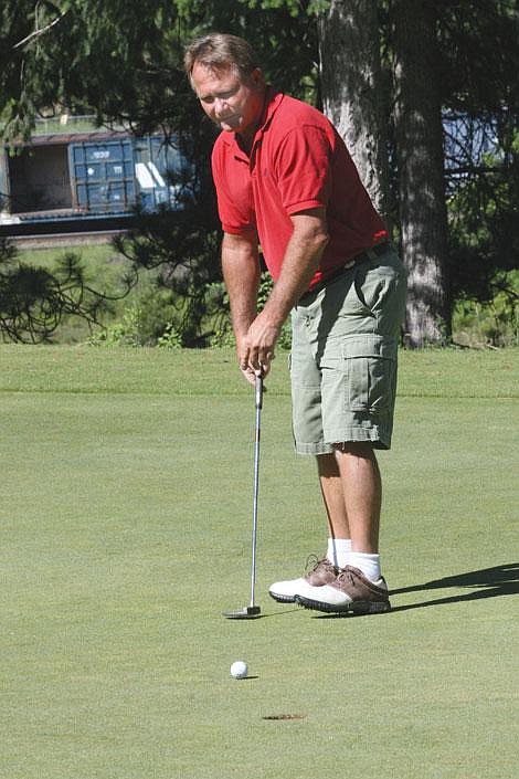 Nick Ianniello/Mineral Independent Randy Davenport watches his putt on the fourth hole of the Trestle Creek Golf course in St. Regis Saturday.